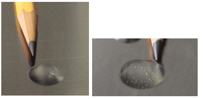 Clear hydraulic oil with and without water bubbles