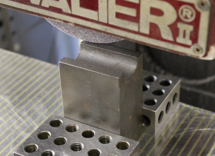 Closeup showing shaving of the face of the clamp die to eliminate wrinkles in the tube fabrication process