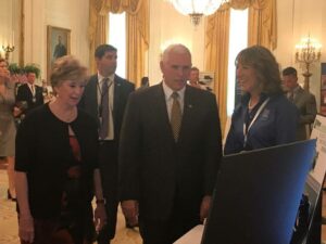 Lisa Winton CEO of Winton Machine USA speaking with US Vice President Mike Pence in 2018