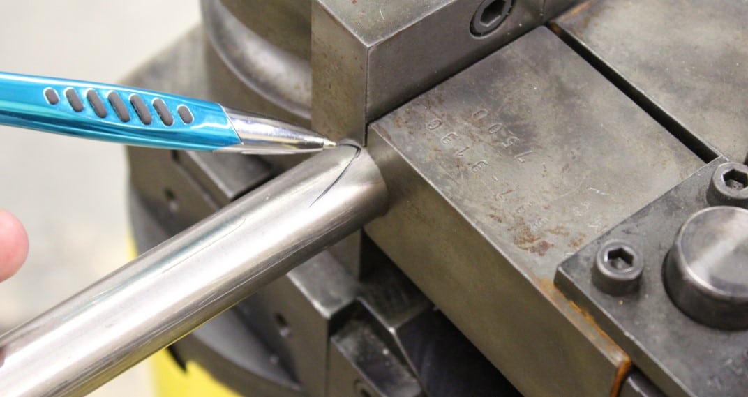 Marking a tube clamped up in a rotary draw bender to find slippage in the tube fabrication process