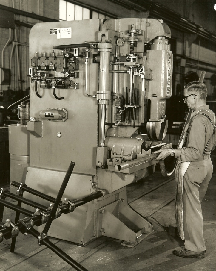 Photo of a Pines bender in 1955 making car exhaust pipes - Winton Machine USA.